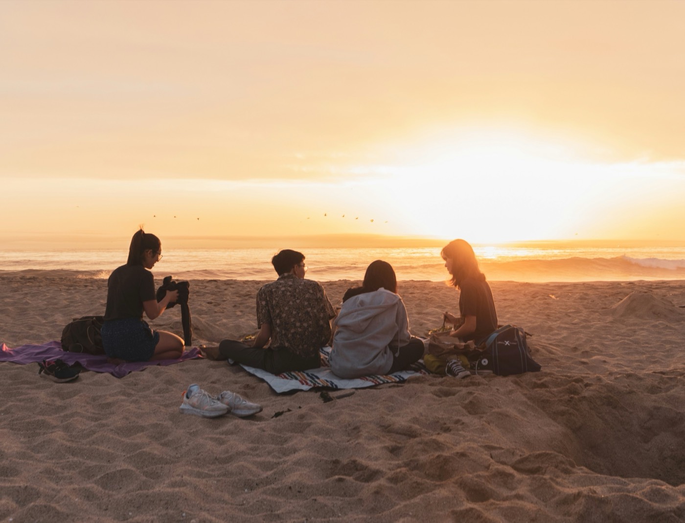 Friends sharing tea casually outdoors